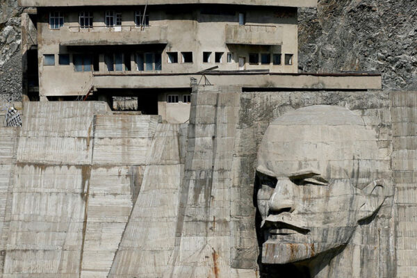 Dam of the Kirov Reservoir with a carved portrait of Lenin, Talas Province, Kyrgyzstan, 1975